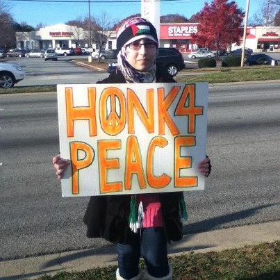  Maitha Ali , While she was holding a sign someone in a van tried to run her over 