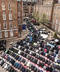  A study in devotion: The tiny mosque on the Brune Street Estate, Spitalfields, holds only 100 people, so the local Bangladeshi community throng the street for Friday midday prayers 