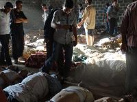  A handout image released by the Syrian opposition's Shaam News Network shows people inspecting bodies of children and adults laying on the ground as Syrian rebels claim they were killed in a toxic gas attack by pro-government forces in eastern Ghouta, on the outskirts of Damascus on August 21, 2013. 