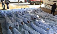  Syrian activists inspect the bodies of people they say were killed by nerve gas in the Ghouta region, in the Duma neighbourhood of Damascus August 21, 2013. 