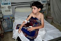  A boy, affected by what activists say is nerve gas, is treated at a hospital in the Duma neighbourhood of Damascus August 21, 2013. 