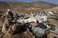  Palestinian man by remains of his house destroyed in Aqraba village West Bank 
